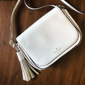 Kate Spade white crossbody with a tassel